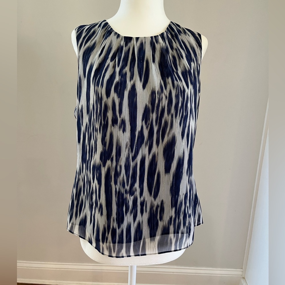 Blue and white animal print pattern with silver and gold threads throughout.